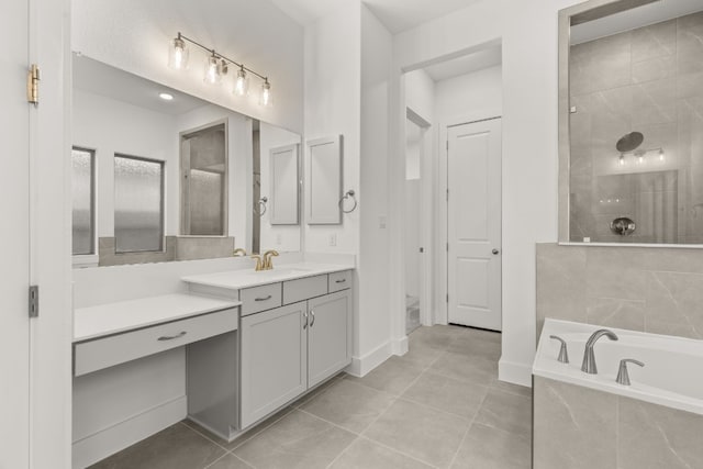 bathroom with vanity, tile patterned floors, and separate shower and tub