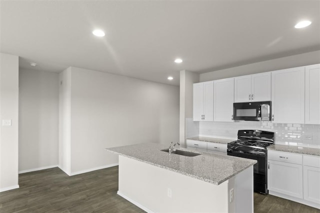 kitchen with decorative backsplash, dark wood-style flooring, black appliances, white cabinetry, and a sink