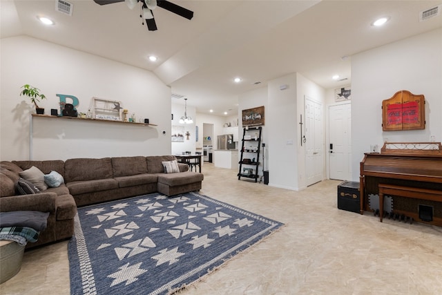 living room with ceiling fan and vaulted ceiling