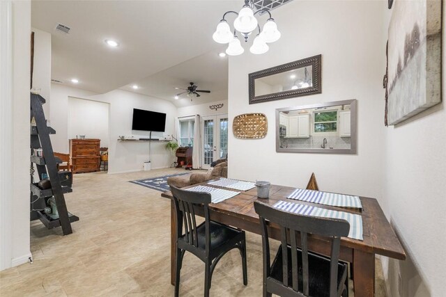 dining room with ceiling fan with notable chandelier