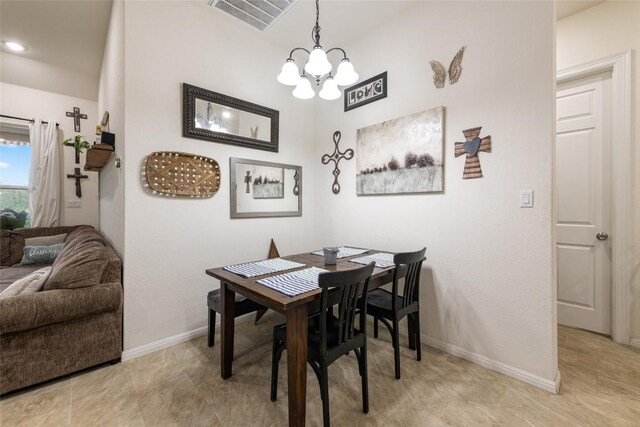 dining space featuring a chandelier