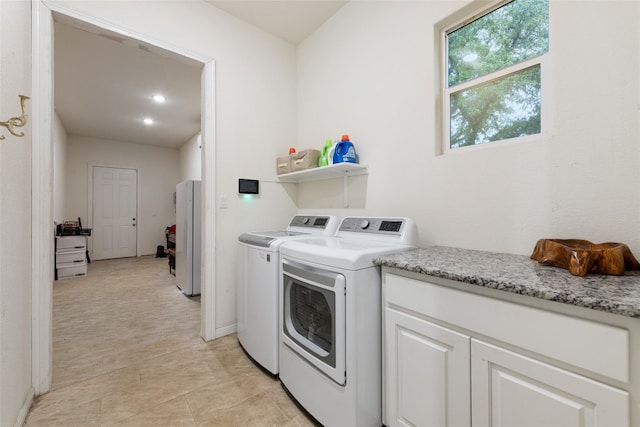 washroom with washing machine and dryer