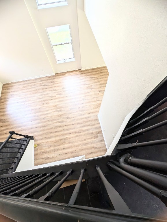 stairs with hardwood / wood-style flooring