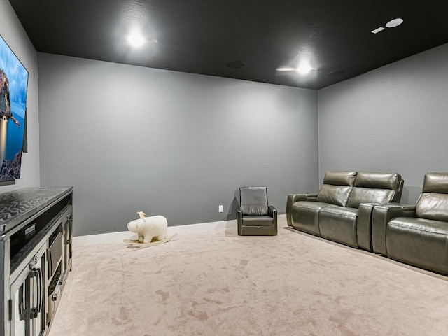 cinema room featuring carpet flooring