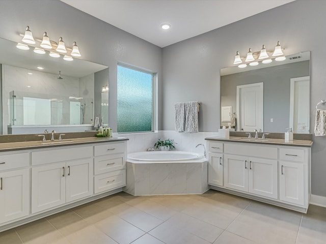 bathroom featuring tile patterned flooring, vanity, and independent shower and bath