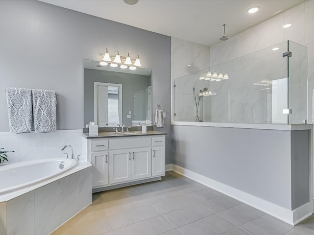 bathroom featuring tile patterned flooring, vanity, and plus walk in shower