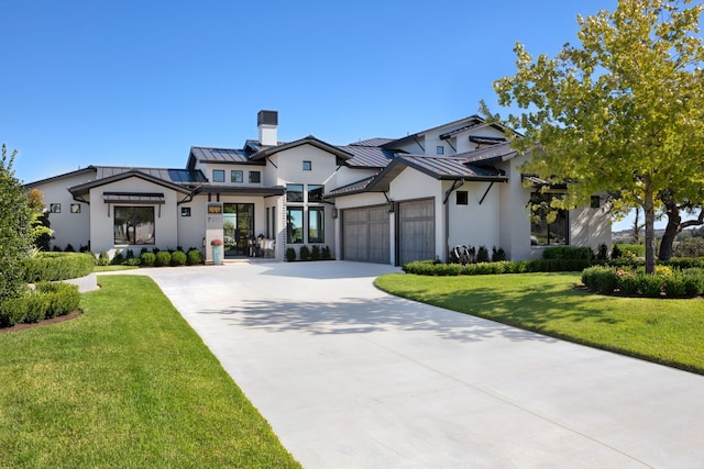 view of front facade featuring a garage and a front lawn