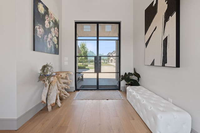 doorway featuring french doors and light hardwood / wood-style flooring