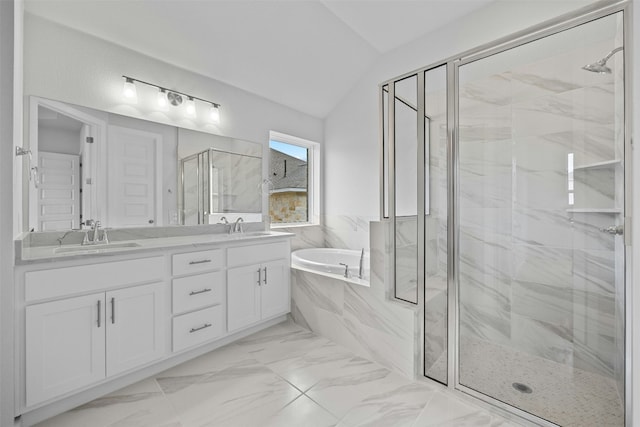 bathroom with vanity, separate shower and tub, and vaulted ceiling