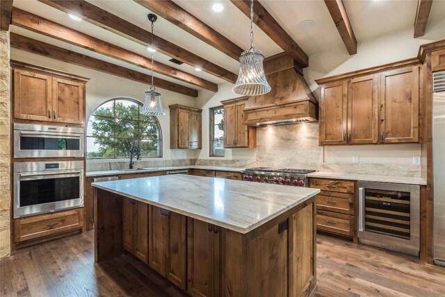 kitchen featuring hanging light fixtures, dark hardwood / wood-style floors, wine cooler, a kitchen island, and beam ceiling