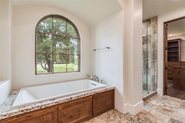 bathroom featuring plus walk in shower