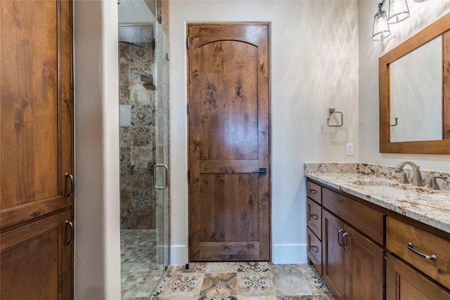 bathroom featuring walk in shower and vanity