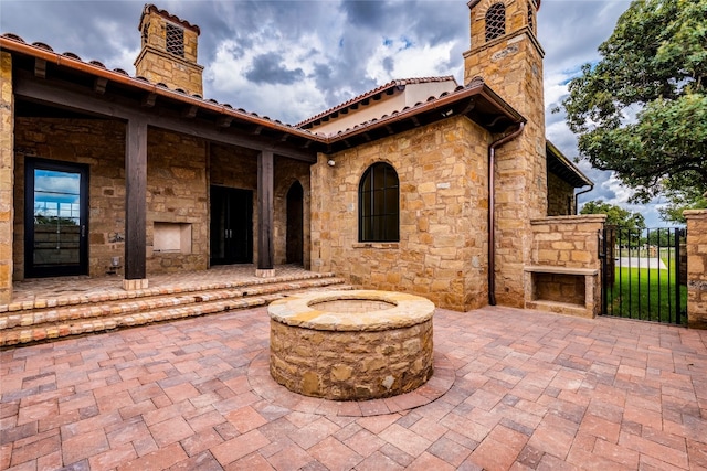 view of patio with a fire pit