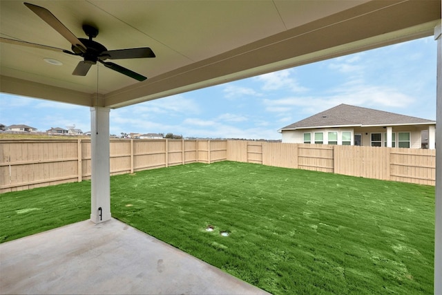 view of yard with a patio and ceiling fan