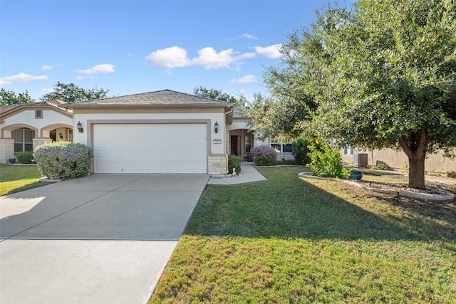 view of front of home with a garage and a front lawn