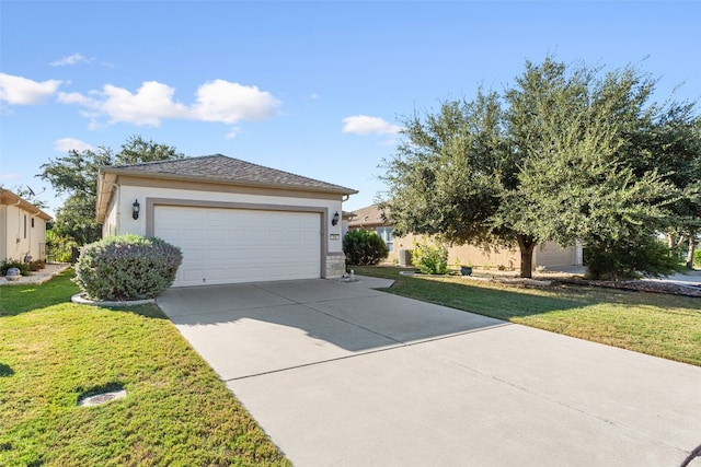 exterior space featuring a lawn and a garage