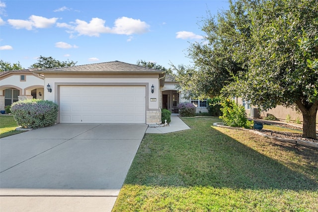 view of front of house featuring a garage and a front lawn