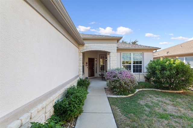 entrance to property with a yard