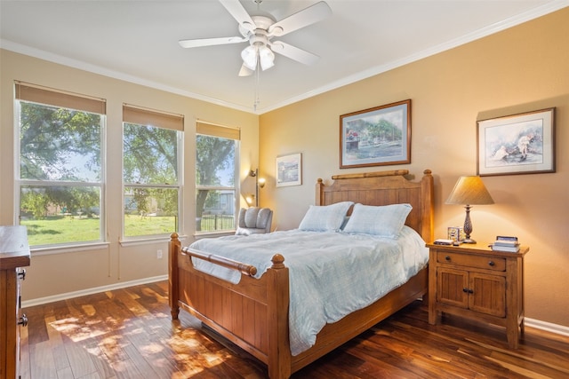 bedroom featuring ceiling fan, dark hardwood / wood-style floors, and ornamental molding