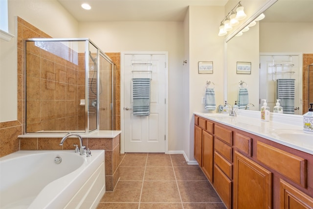 bathroom with independent shower and bath, vanity, and tile patterned flooring