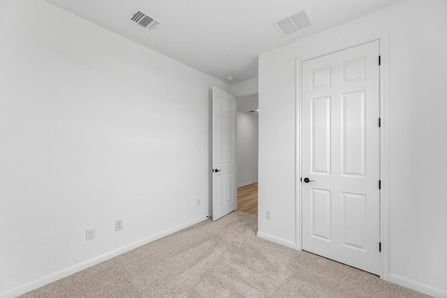 1004 Stonehill Dr, Georgetown, TX 78633 - unfurnished bedroom featuring light colored carpet and baseboards