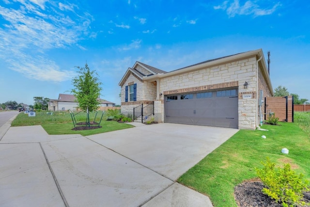 1004 Stonehill Dr, Georgetown, TX 78633 - view of front of home featuring stone siding, an attached garage, and driveway