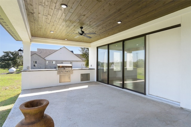 view of patio / terrace featuring exterior kitchen, area for grilling, ceiling fan, and sink