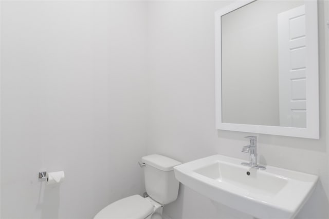 bathroom featuring sink and toilet