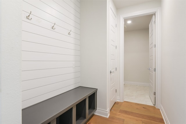 mudroom with light hardwood / wood-style floors