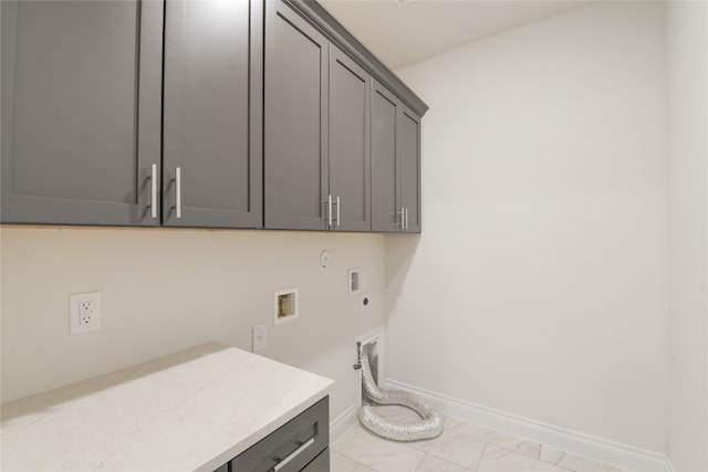 laundry room featuring hookup for a washing machine, hookup for an electric dryer, light tile patterned floors, hookup for a gas dryer, and cabinets