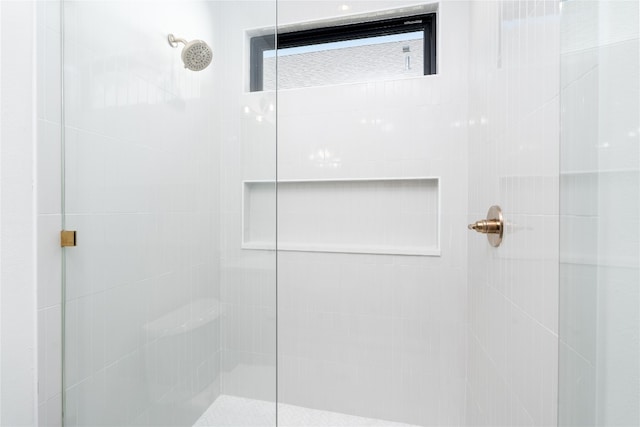 bathroom with a tile shower