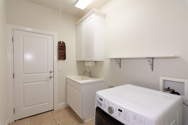 laundry room featuring cabinets, washer hookup, light tile patterned floors, and sink