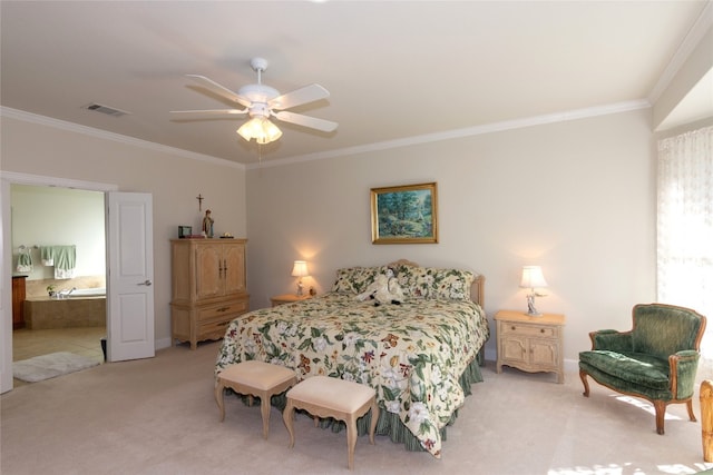 bedroom featuring carpet floors, ensuite bath, ceiling fan, and ornamental molding