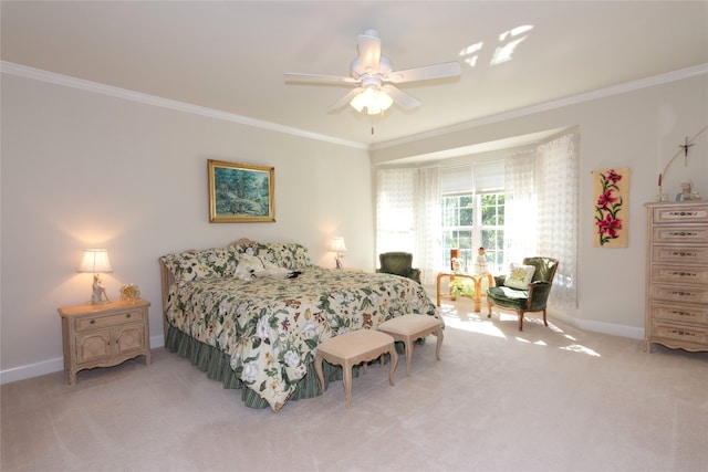 bedroom with carpet, ceiling fan, and crown molding