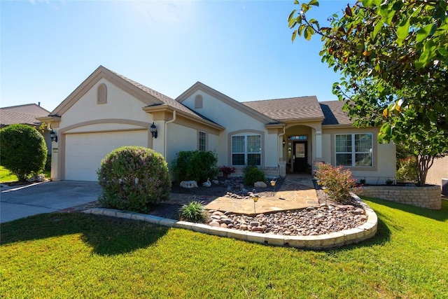 ranch-style house featuring concrete driveway, a garage, a front lawn, and stucco siding