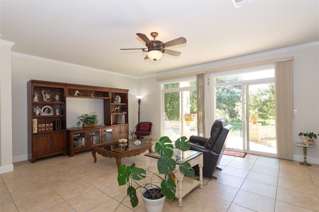 tiled living room with ceiling fan and ornamental molding