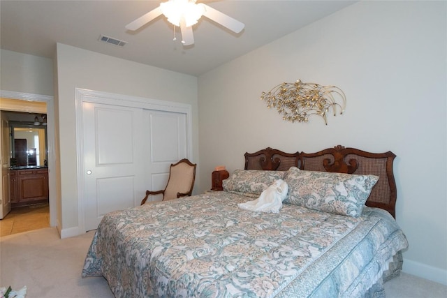 411 Palmetto Dr, Georgetown, TX 78633 - bedroom with light carpet, a closet, baseboards, and ceiling fan