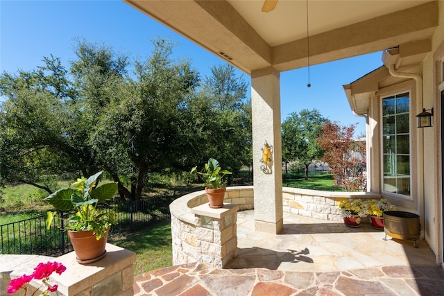 view of patio featuring ceiling fan