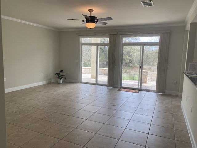 411 Palmetto Dr, Georgetown, TX 78633 - empty room with plenty of natural light, light tile patterned floors, crown molding, and ceiling fan