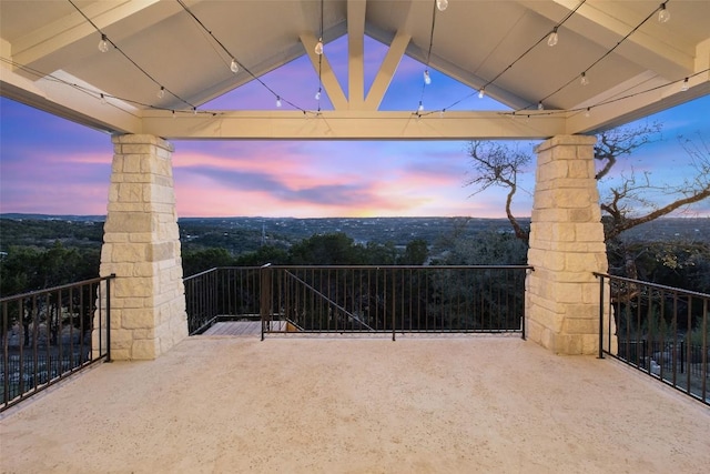 view of patio terrace at dusk