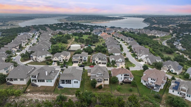 aerial view at dusk with a water view