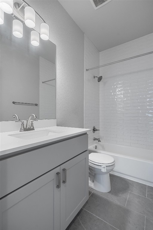 full bathroom with tile patterned flooring, vanity, toilet, and  shower combination