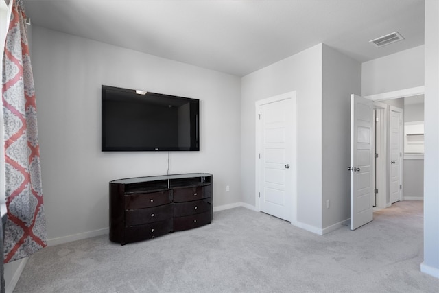 unfurnished bedroom featuring light colored carpet