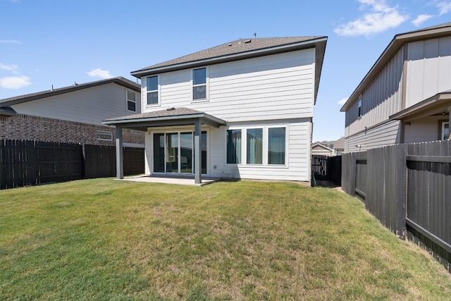 back of property featuring a lawn and a patio area