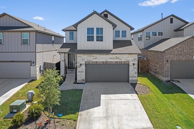 view of front of house with a garage and a front lawn