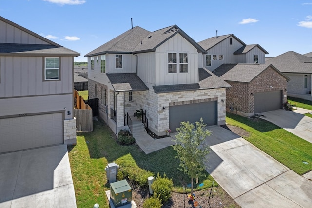 view of front of home with a garage and a front lawn