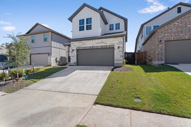 view of front of property featuring a garage and a front yard