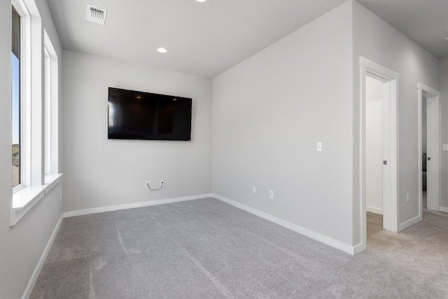 unfurnished room featuring carpet flooring