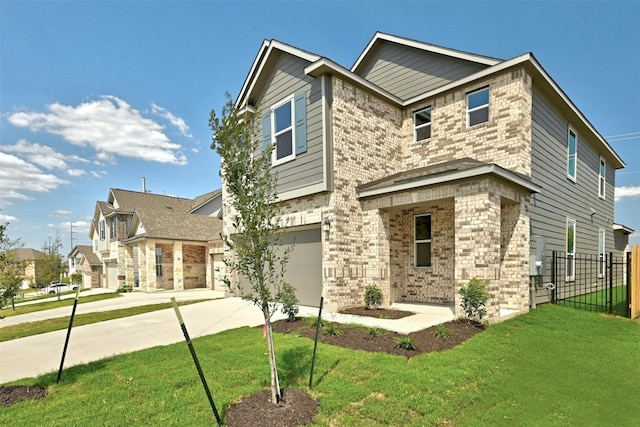 view of front of home featuring a garage and a front yard