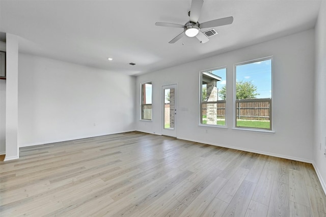 spare room with ceiling fan and light hardwood / wood-style flooring